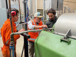 Workers examining some equipment